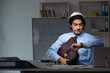 © Elnur - Young male architect working night at office