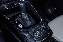 Сlose-up Of The Car  Black Interior:  Dashboard,  Accelerator Handle, Parking Systems, Seats And Other Buttons.