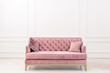 © speed300 - Modern living-room minimalistic  interior with pink sofa near empty white wall. - Image