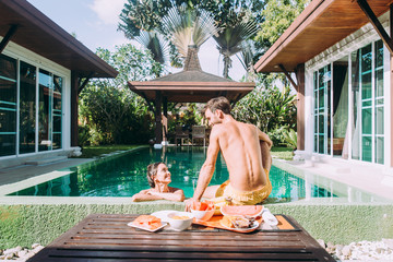 happy couple spending time in a beautiful vacation house