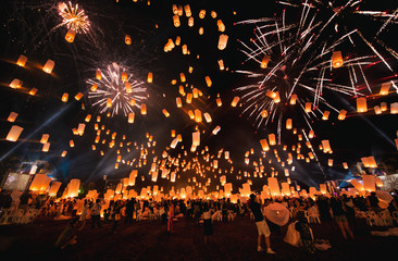 Loy krathong festival, thai new year party with floating lanterns release in the night sky