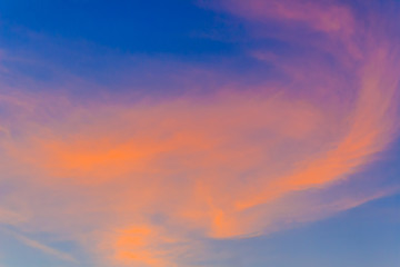 Wall Mural -  Red clouds on blue sky in twilight evening. Beautiful sunset sky with blue and red background. Dramatic colorful of dusk and dawn sky with blue sky and red clouds.