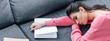 © LIGHTFIELD STUDIOS - tired indian student sleeping on sofa with notebook and book