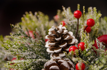 christmas composition with pine cones and candle