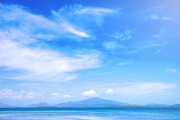 Beautiful ocean scene view isolated with light blue sky background, concept of vacation and sea travel, copy space