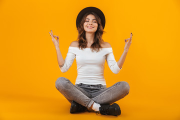 Wall Mural - Portrait of a cheerful young woman wearing white shirt