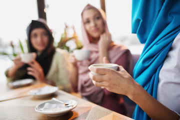 Wall Mural - Muslims are having fun at a coffee shop