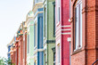 © Kristina Blokhin - Row of colorful red green and blue painted brick residential townhouses homes houses architecture exterior in Washington DC Capitol Hill neighborhood district