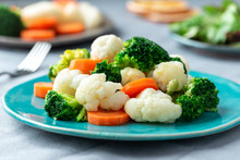 Vegetarian Food, Boiled Vegetables. Broccoli, Cauliflower And Carrots.