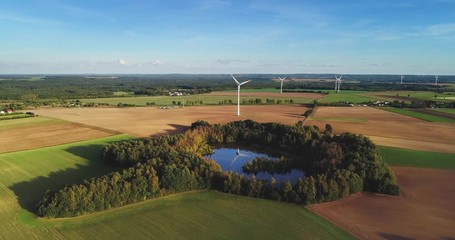 Wall Mural - Wind turbines on summer field. Alternative, clean and natural energy