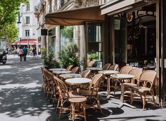 Wall Mural - boulevard san-german with tables of cafe in paris, france