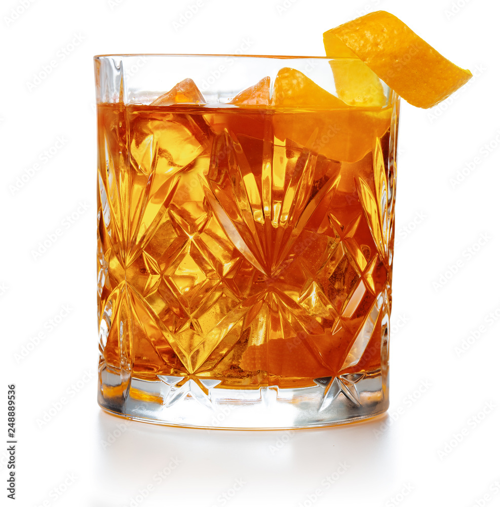 old fashioned cocktail garnished with orange twist peel isolated - obrazy, fototapety, plakaty 