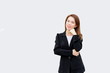 © iamchamp - asian business woman thinking and smiling at camera with long hair in black suit isolated on white color background