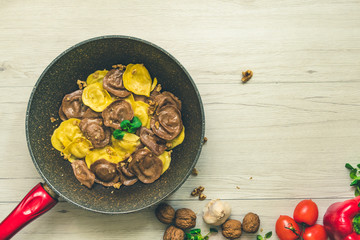 Wall Mural - Cassic ravioli filled with nuts and cheese in a cooking pan.