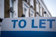 'To Let' estate agent sign on residential street