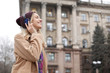 © New Africa - Young woman with headphones listening to music outdoors. Space for text