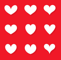 Wall Mural - White hearts set of icons on red background.