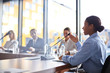 © Seventyfour - Young mixed-race female speaker explaining points of her report to audience at business conference