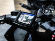 Motorcycle travel navigation on the handlebars of the bike, Finding a location on maps using the mobile on a smartphone.