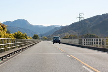 A Vehicle Driving Across A Bridge In The Marlborough Region Of New Zealand Along State Highway 6.