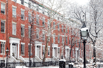 Wall Mural - Snow covered winter street scene with old buildings along Washington Square Park in Manhattan New York City NYC