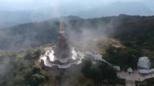 Footage Of Drone Flying Over The Temple Doi Inthanon (Doi Luang)  In Chiang Mai In Thailand With Clouds Passing By