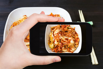 Canvas Print - top view of kimchi in white bowl and chopsticks