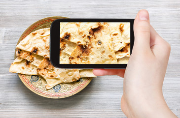 Poster - Naan flat bread on brass plate isolated