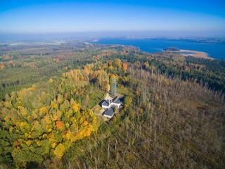 Wall Mural - Aerial view of observation tower located on terrain of German Land Forces Headquarters from ww2 hidden in a forest in autumn season in Mamerki, Poland (former Mauerwald, East Prussia)