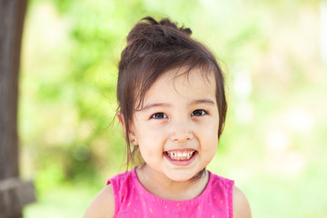 Happy cute asian girl outdoors. Summer time