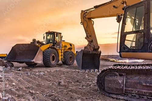 Fotografía Group of excavator working on a construction site