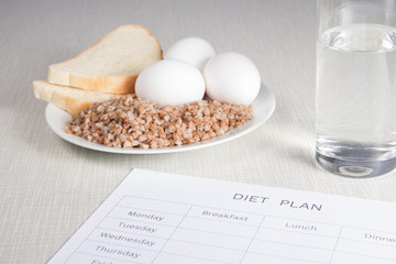 Notebook with buckwheat,bread,eggs and water