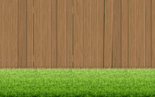 Grass Lawn And Brown Wooden Fence.