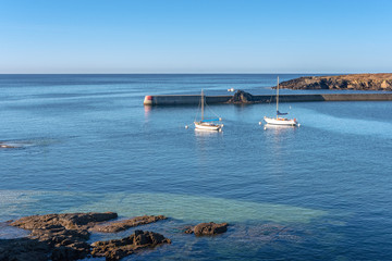 Wall Mural - French landscape - Bretagne. Sailing boats in a beautiful bay after sunrise.