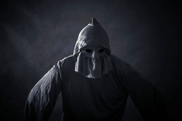 Wall Mural - Scary figure in hooded cloak