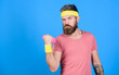 Athlete on way to stronger body. Healthy habits. Sportsman retro outfit training blue background. Athlete training with little dumbbell. Man bearded athlete exercising dumbbell. Motivated athlete guy