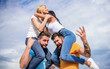 © be free - Friendship of families. Couples in love having fun. Men carry girlfriends on shoulders. Summer vacation and fun. Couples on double date. Inviting another couple to join. Twice fun on double date