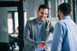 canvas print picture - Portrait of cheerful young manager handshake with new employee.