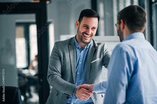 Fotografía Portrait of cheerful young manager handshake with new employee.