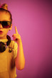© master1305 - Neon portrait of young girl with headphones enjoying music. Lifestyle of young people, human emotions, childhood, happiness concept.