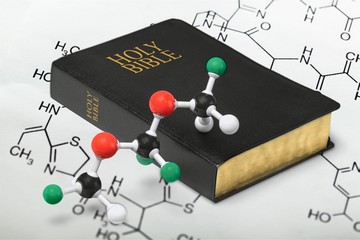 holy bible and chemistry form, close-up view
