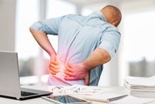 Man With Back Pain In Office