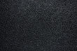 Black glitter sandpaper background with texture, Close-up