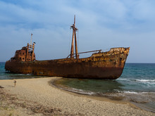 Rusty Corroding Dimitrios Shipwreck On A Sandy Beach Near Gythio, Greece