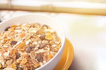 Sticker - Bowl of  tasty corn flakes  on background