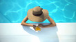 © motortion - Young woman in elegant hat swimming in pool and enjoying delicious cocktail
