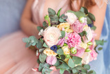 Fototapeta Storczyk - Wedding flowers in tender girls hands 