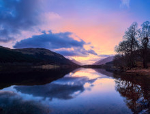Scottish Beautiful Colorful Sunset Landscape With Loch Voil, Mountains And Forest At Loch Lomond & The Trossachs National Park