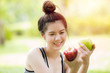 apple in asian girl hand, green or red apple color fruit choice for healthy people concept.