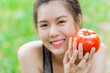 teen with Tomato smile happy good healthy skin eating vegetable rich Lycopene.
